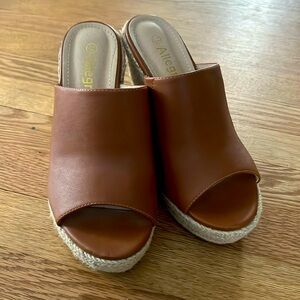 Beautiful brown wedges. Size 7.5 worn once. Great buy! No issues!
